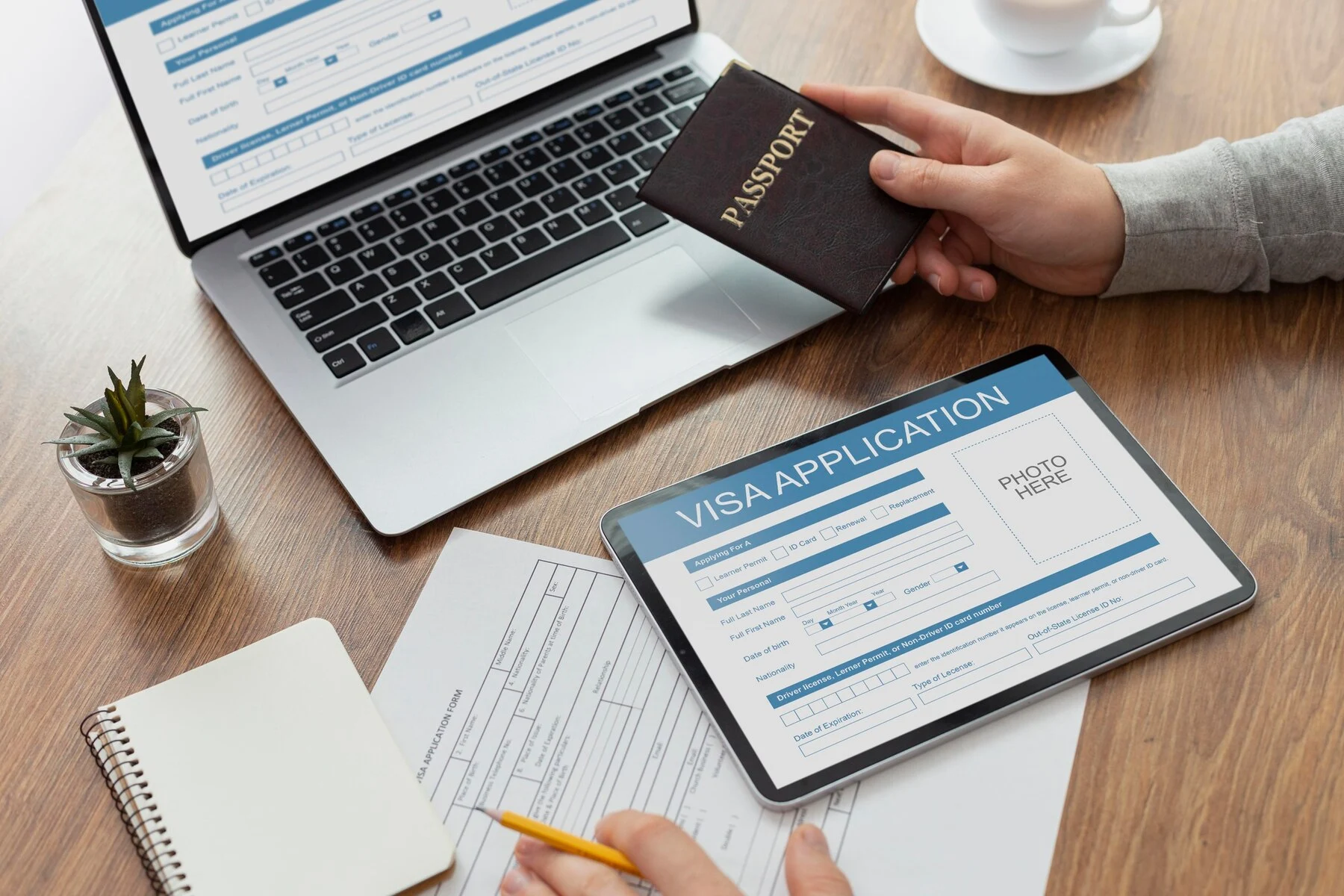 Visa application from laptop table